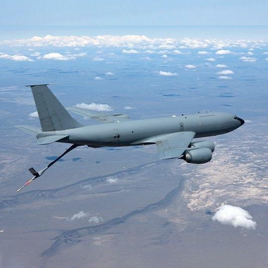 KC-146 aircraft flying and refuleing another platform utilizes dual-band antennas for airborne communications